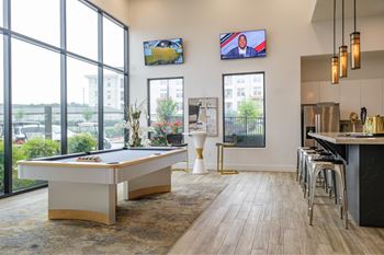 social lounge with billiards at Reveal Skyline apartments